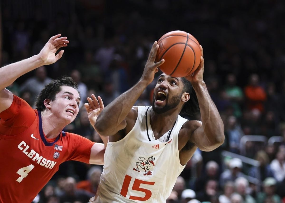 Jan 3, 2024; Coral Gables, Florida, USA; Miami Hurricanes forward Norchad Omier (15) drives to the basket against Clemson Tigers forward Ian Schieffelin (4) during the second half at Watsco Center.