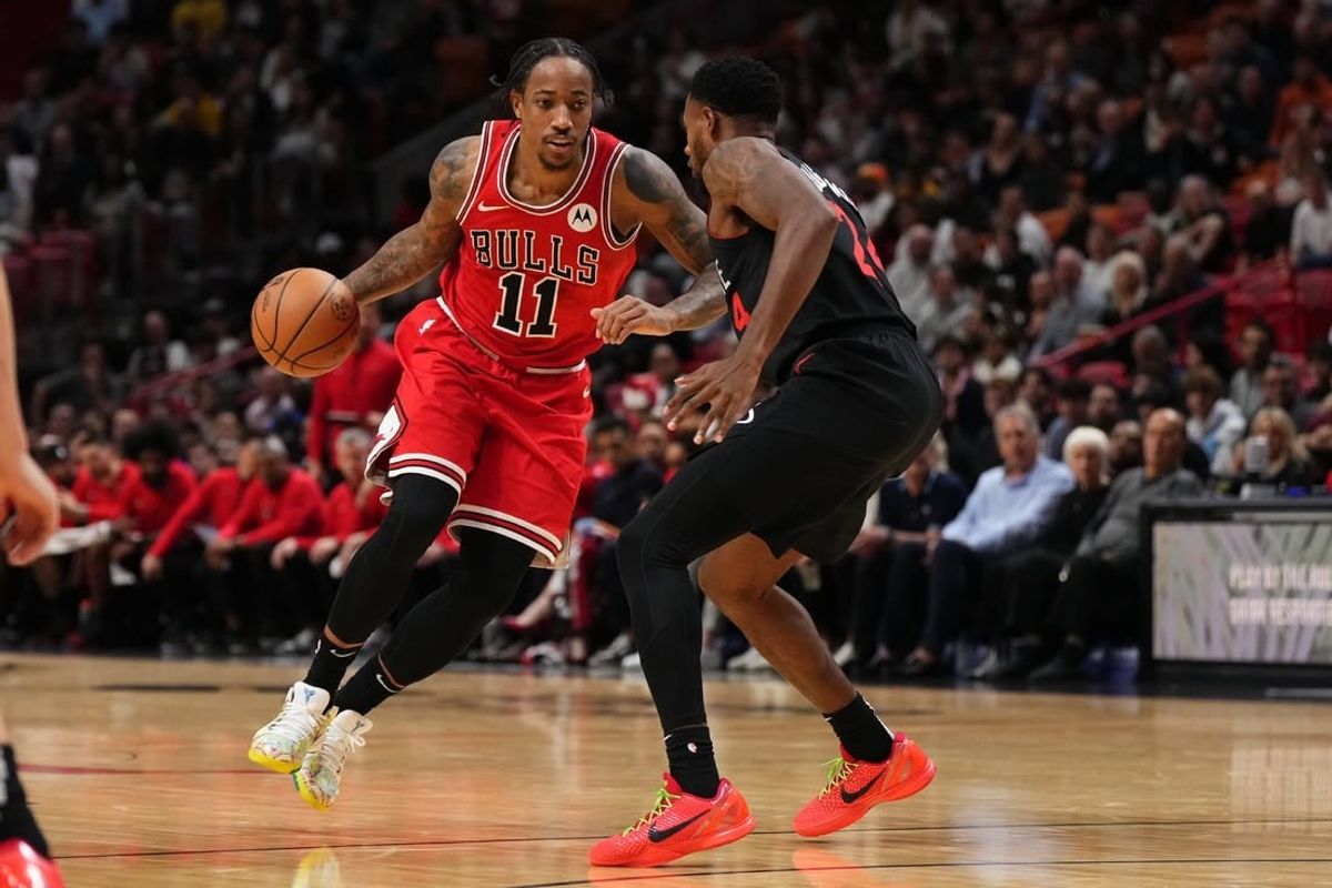 Dec 16, 2023; Miami, Florida, USA; Chicago Bulls forward DeMar DeRozan (11) drives the ball around Miami Heat forward Haywood Highsmith (24) during the first half at Kaseya Center.