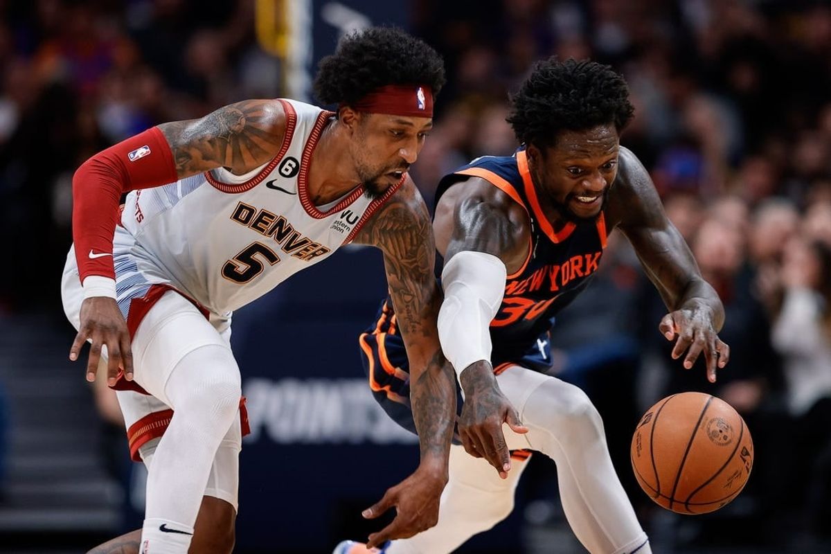 Nov 16, 2022; Denver, Colorado, USA; Denver Nuggets guard Kentavious Caldwell-Pope (5) and New York Knicks forward Julius Randle (30) battle for a loose ball in the fourth quarter at Ball Arena.
