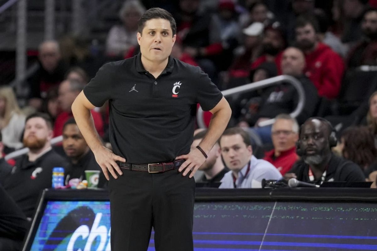 Dec 29, 2023; Cincinnati, Ohio, USA;  Cincinnati Bearcats head coach Wes Miller watches from down court in the game against the Evansville Aces in the first half at Fifth Third Arena.