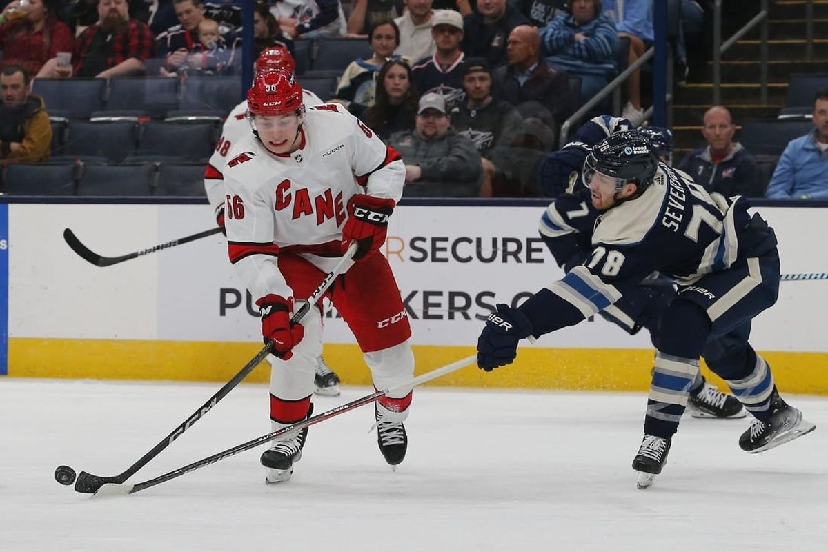 Apr 16, 2024; Columbus, Ohio, USA; Columbus Blue Jackets defenseman Damon Severson (78) sticks the puck away from Carolina Hurricanes defenseman Scott Morrow (56) during the third period at Nationwide Arena.