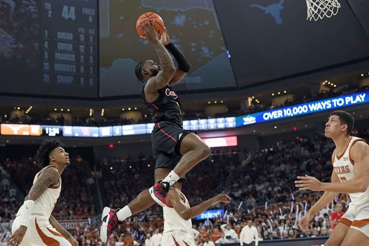 Jan 29, 2024; Austin, Texas, USA; Houston Cougars guard Jamal Shead (1) drives to the basket during the second half against the Texas Longhorns at Moody Center.