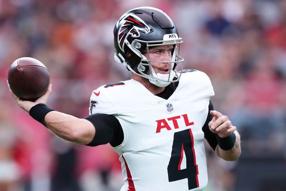 Nov 12, 2023; Glendale, Arizona, USA; Atlanta Falcons quarterback Taylor Heinicke (4) throws against the Arizona Cardinals during the first half at State Farm Stadium.