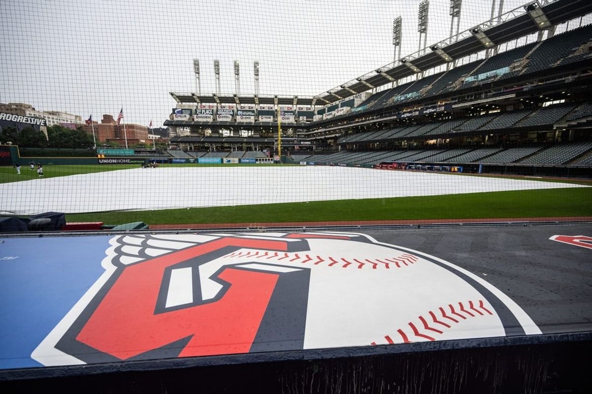 Aug 17, 2023; Cleveland, Ohio, USA; The tarp covers the field as the game between the Cleveland Guardians and the Detroit Tigers is postponed at Progressive Field.