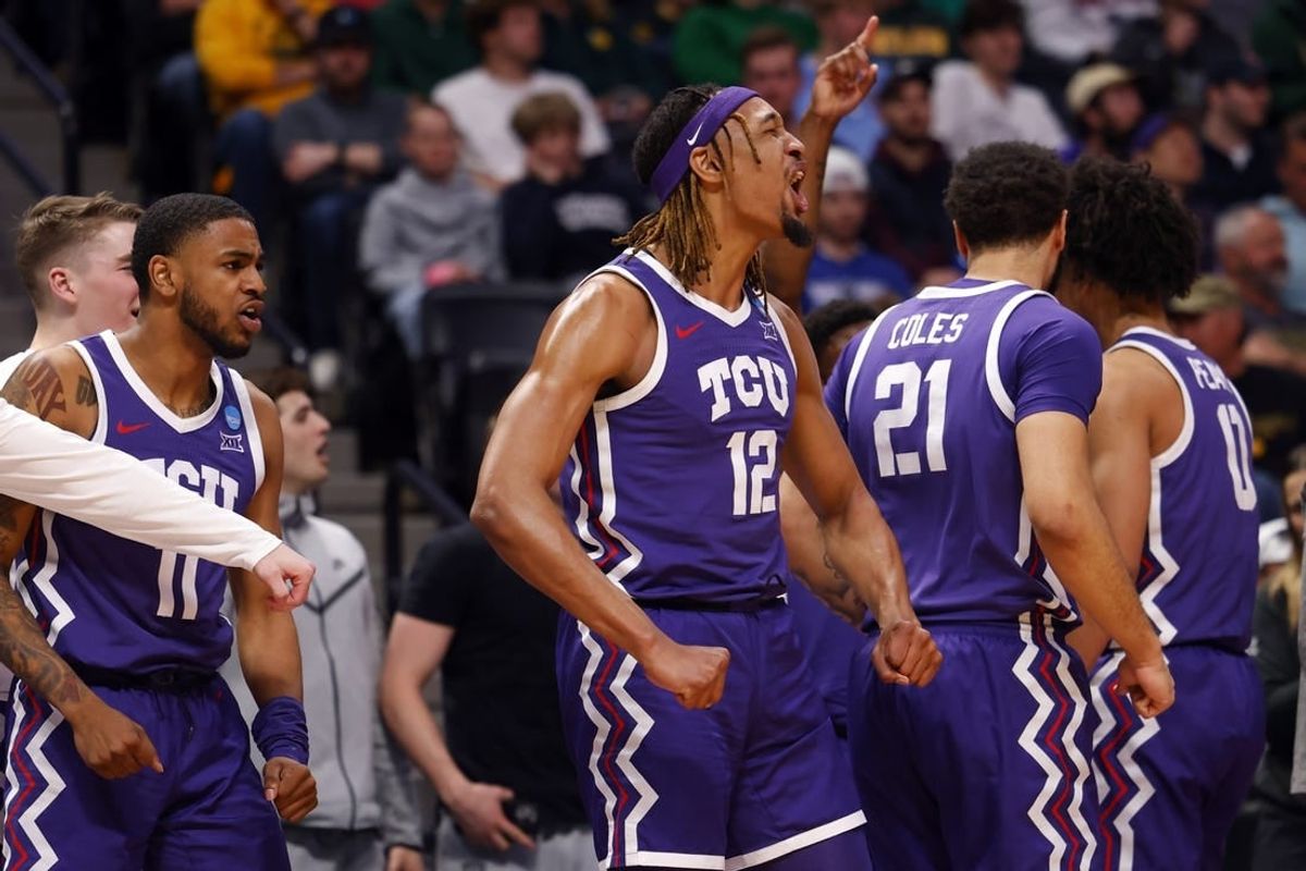 Mar 19, 2023; Denver, CO, USA; TCU Horned Frogs forward Xavier Cork (12) and guard Rondel Walker (11) and forward JaKobe Coles (21) celebrate on the bench in the first half against the Gonzaga Bulldogs at Ball Arena.