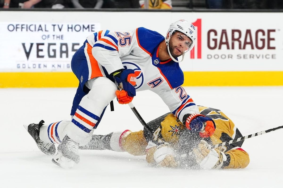 Feb 6, 2024; Las Vegas, Nevada, USA; Edmonton Oilers defenseman Darnell Nurse (25) takes down Vegas Golden Knights center Paul Cotter (43) during the first period at T-Mobile Arena.