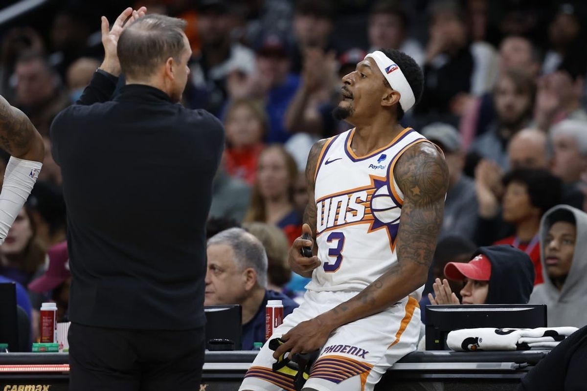 Feb 4, 2024; Washington, District of Columbia, USA; Phoenix Suns head coach Frank Vogel (L) applauds Suns guard Bradley Beal (3) after removing him from the game against the Washington Wizards in the second half at Capital One Arena.