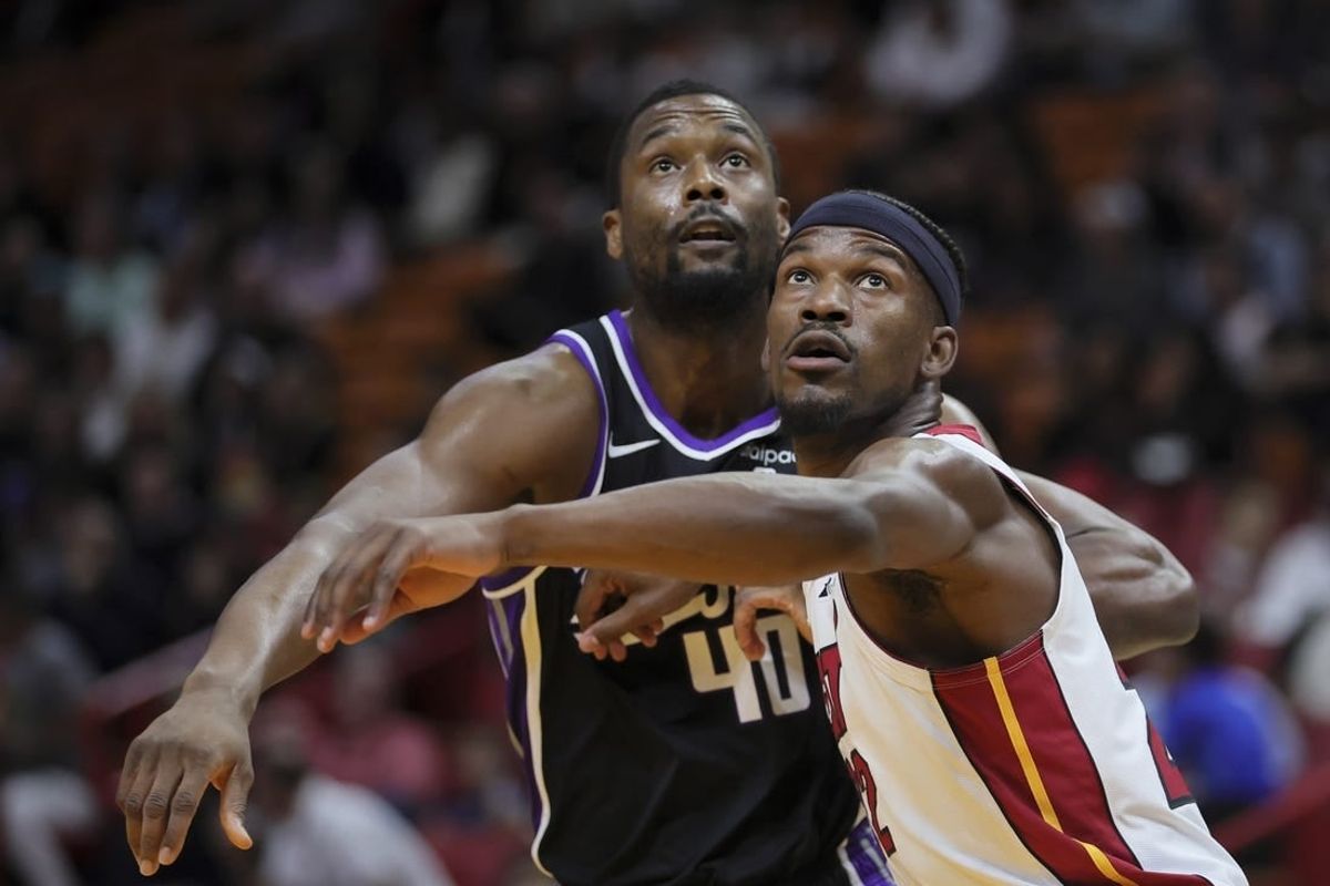 Jan 31, 2024; Miami, Florida, USA; Miami Heat forward Jimmy Butler (22) guards Sacramento Kings forward Harrison Barnes (40) during a free throw attempts in the first quarter at Kaseya Center.