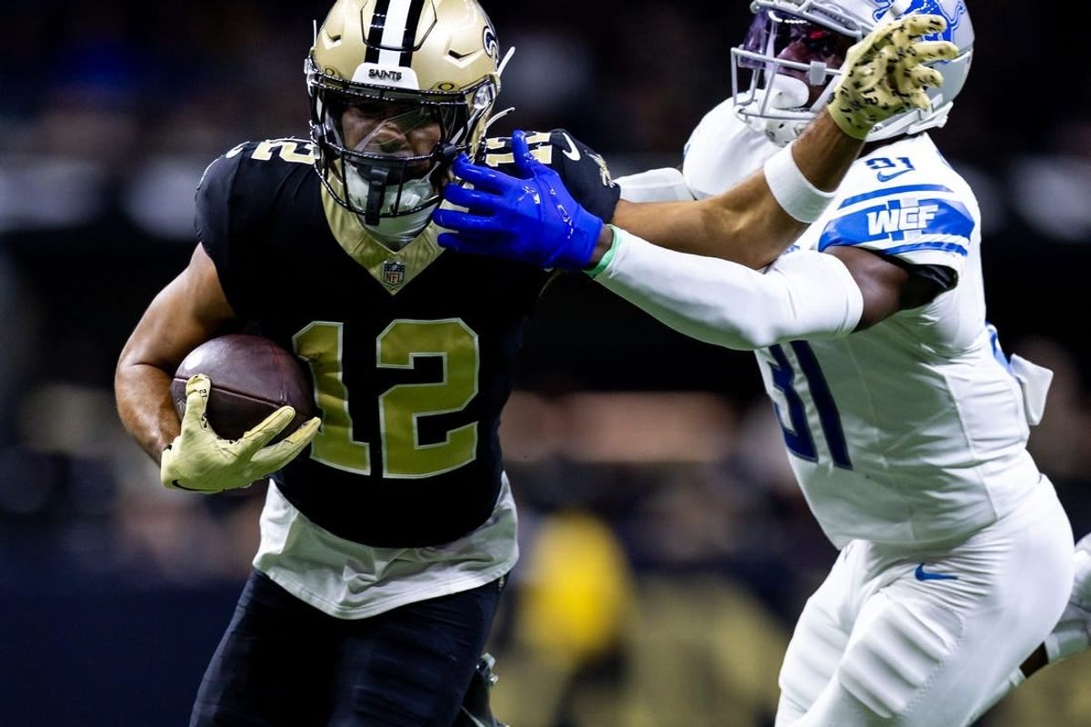 Dec 3, 2023; New Orleans, Louisiana, USA; Detroit Lions safety Kerby Joseph (31) tackles New Orleans Saints wide receiver Chris Olave (12) during the first half at the Caesars Superdome.