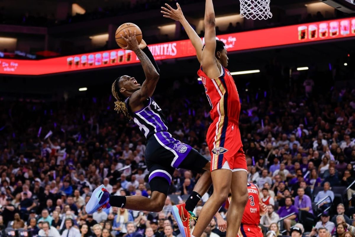 Apr 2, 2024; Sacramento, California, USA; Sacramento Kings guard Keon Ellis (23) shoots the ball against New Orleans Pelicans guard Trey Murphy III (25) during the second quarter at Golden 1 Center.