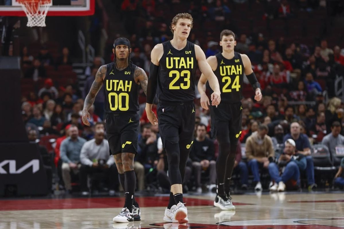 Nov 6, 2023; Chicago, Illinois, USA; Utah Jazz forward Lauri Markkanen (23), Utah Jazz guard Jordan Clarkson (00) and Utah Jazz center Walker Kessler (24) walk on the court during the first half of a basketball game against the Chicago Bulls at United Center.