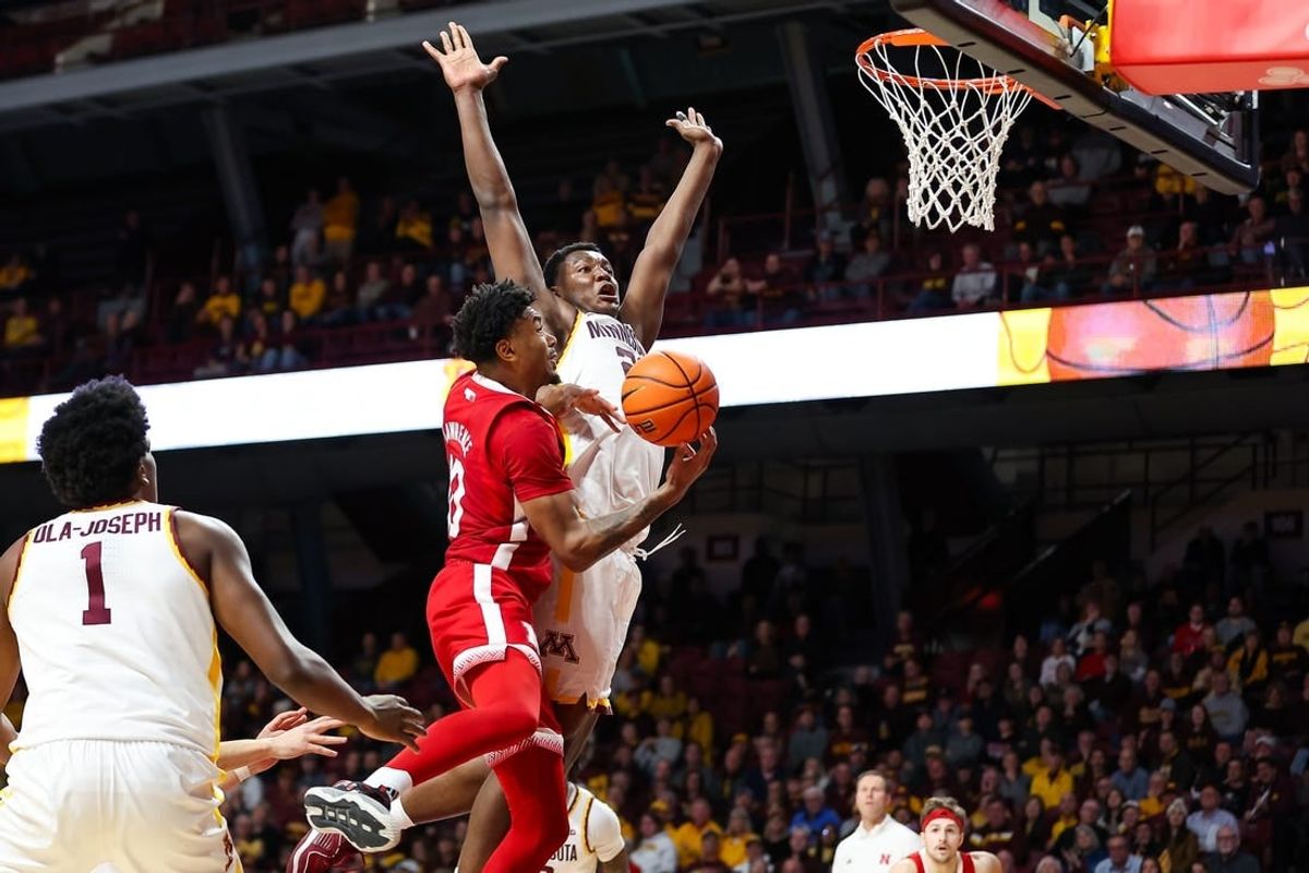 Dec 6, 2023; Minneapolis, Minnesota, USA; Nebraska Cornhuskers guard Jamarques Lawrence (10) drives to the basket as Minnesota Golden Gophers forward Pharrel Payne (21) defends during the second half at Williams Arena.