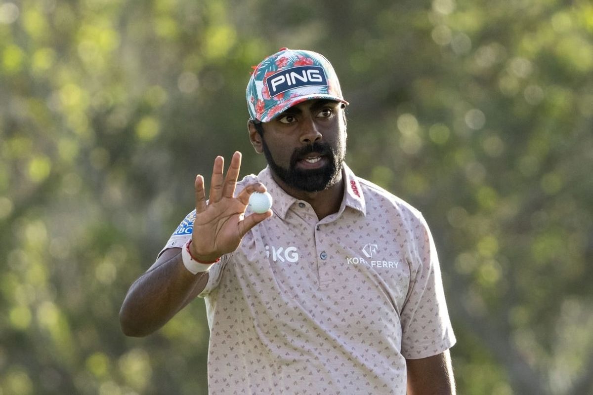 January 4, 2024; Maui, Hawaii, USA; Sahith Theegala acknowledges the crowd after making his putt on the 18th hole during the first round of The Sentry golf tournament at Kapalua Golf - The Plantation Course.