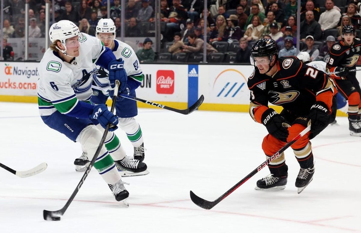 Mar 3, 2024; Anaheim, California, USA; Vancouver Canucks right wing Brock Boeser (6) shoots against Anaheim Ducks defenseman Gustav Lindstrom (28) during the first period at Honda Center.