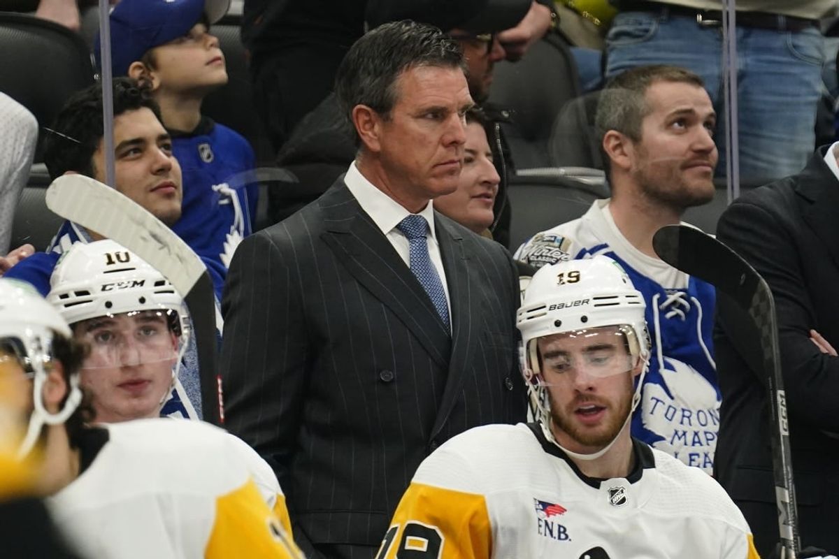 Dec 16, 2023; Toronto, Ontario, CAN; Pittsburgh Penguins head coach Mike Sullivan (middle) looks on from the bench during the second period against the Toronto Maple Leafs at Scotiabank Arena.