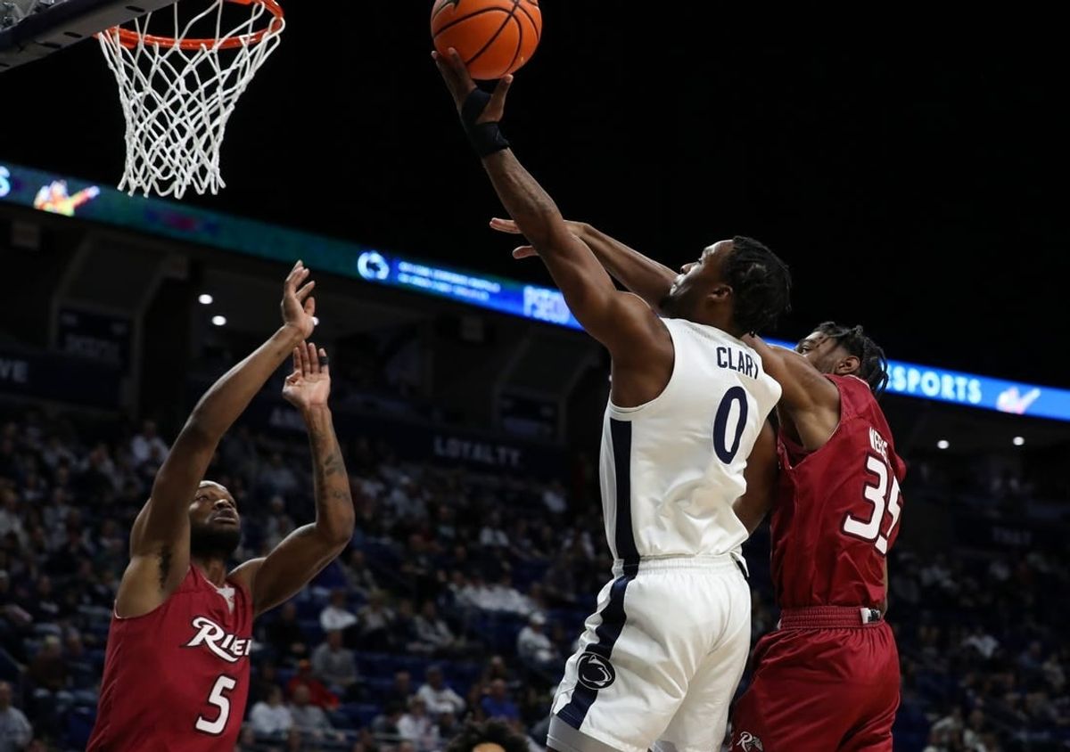 Dec 29, 2023; University Park, Pennsylvania, USA; Penn State Nittany Lions guard Kanye Clary (0) drives the ball to the basket as Rider Broncs guard TJ Weeks Jr (35) defends during the first half at Bryce Jordan Center.