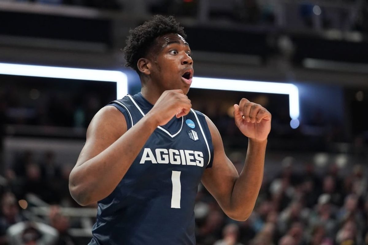 Mar 24, 2024; Indianapolis, IN, USA; Utah State Aggies forward Great Osobor (1) reacts during the first half against the Purdue Boilermakers at Gainbridge FieldHouse.