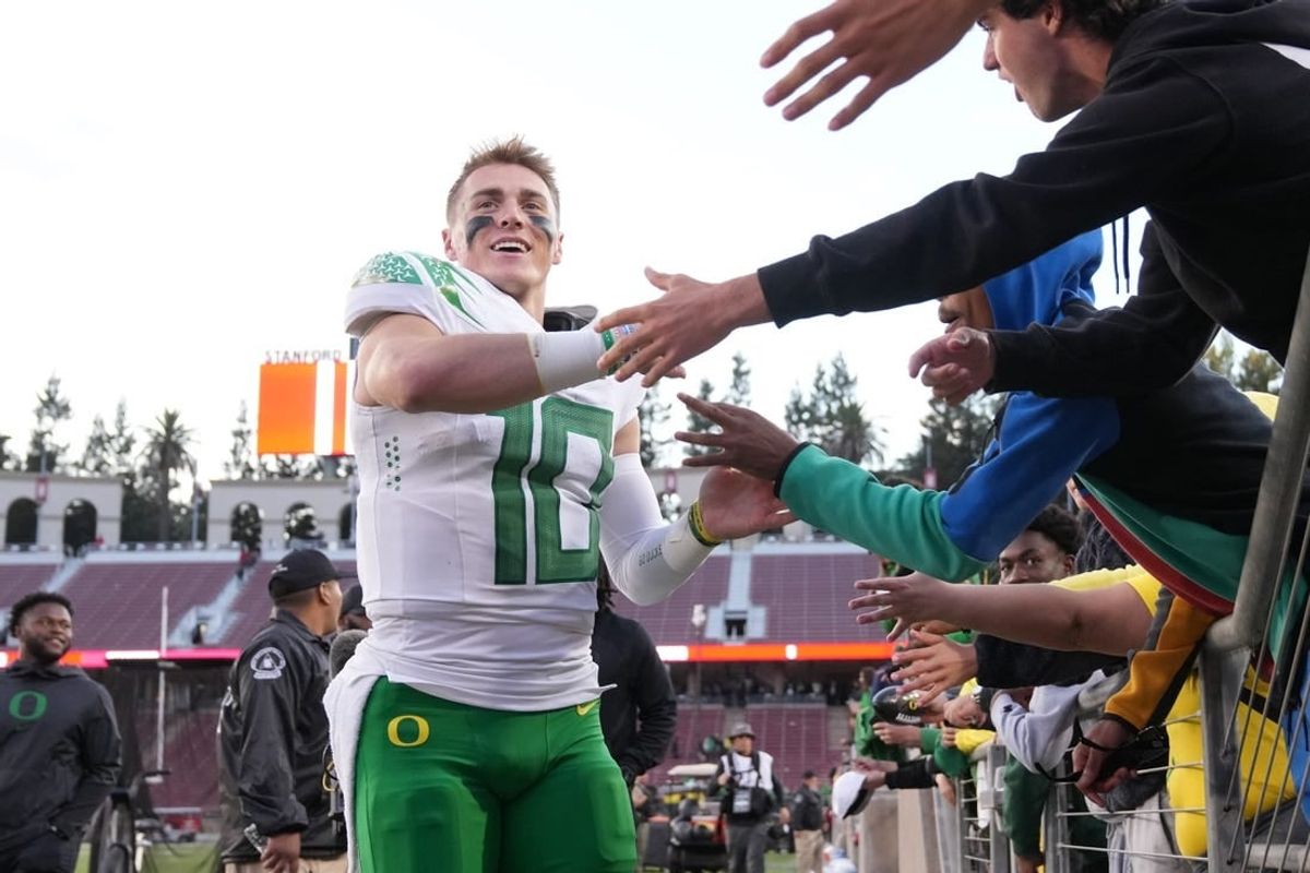 Sep 30, 2023; Stanford, California, USA; Oregon Ducks quarterback Bo Nix (10) celebrates with fans after defeating the Stanford Cardinal at Stanford Stadium.