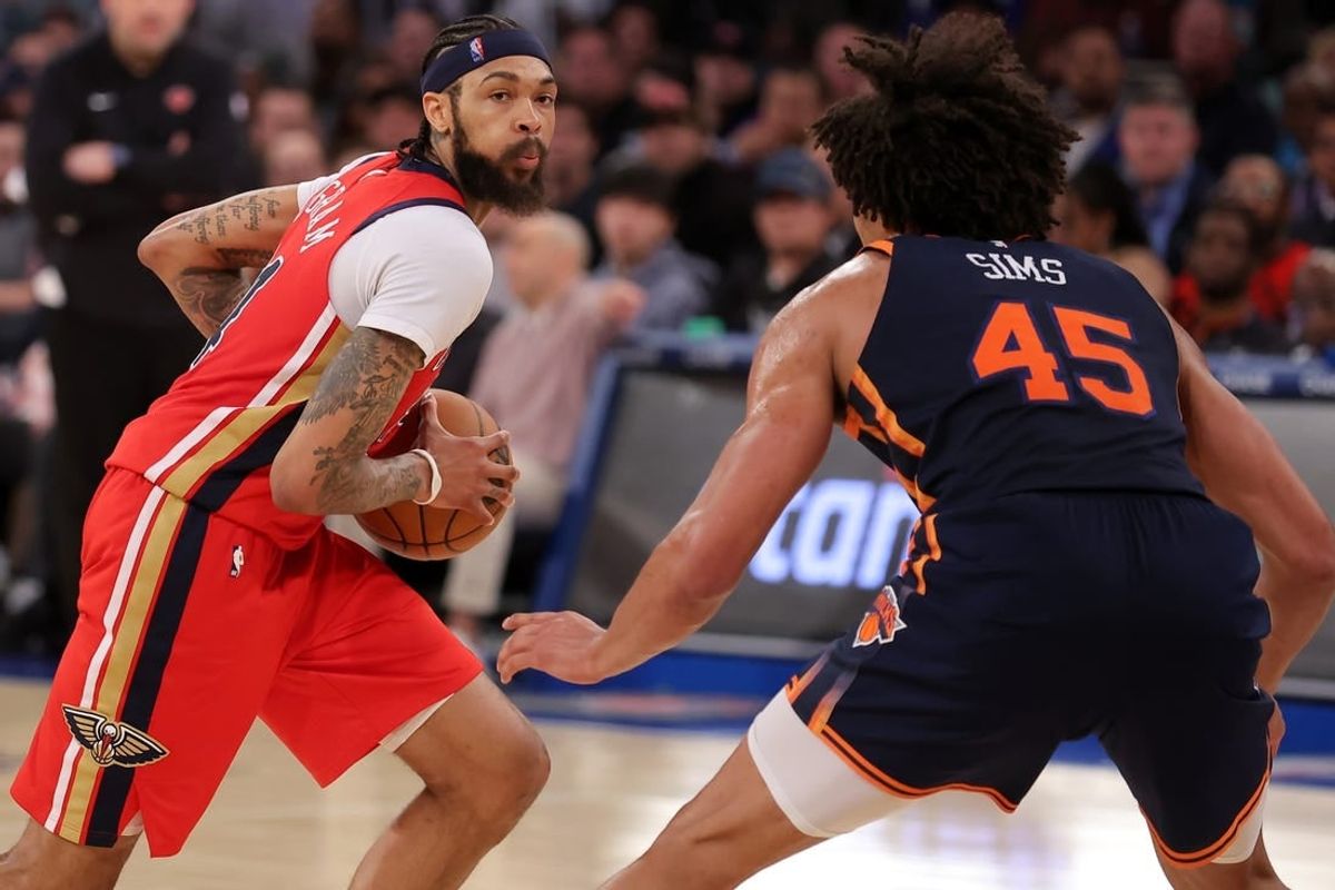 Feb 27, 2024; New York, New York, USA; New Orleans Pelicans forward Brandon Ingram (14) controls the ball against New York Knicks center Jericho Sims (45) during the third quarter at Madison Square Garden.
