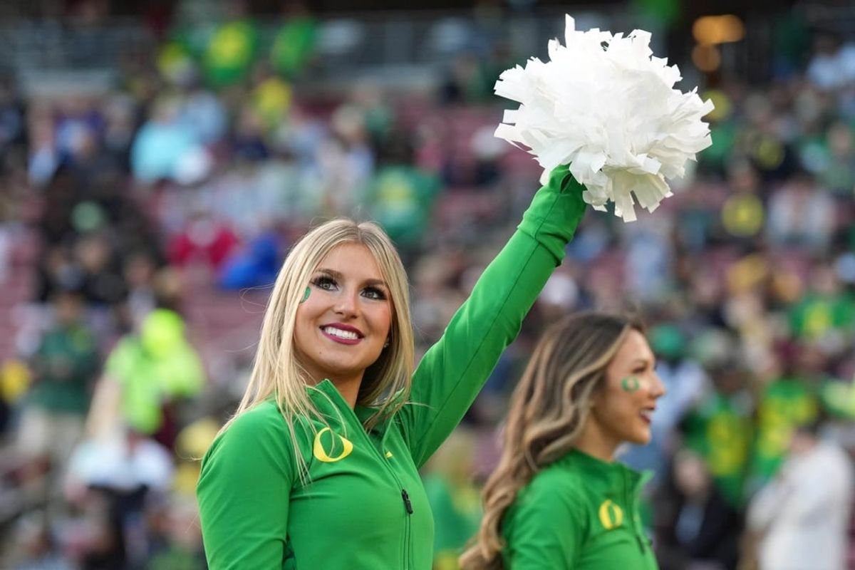 Sep 30, 2023; Stanford, California, USA; An Oregon Ducks cheerleader performs during the third quarter against the Stanford Cardinal at Stanford Stadium.