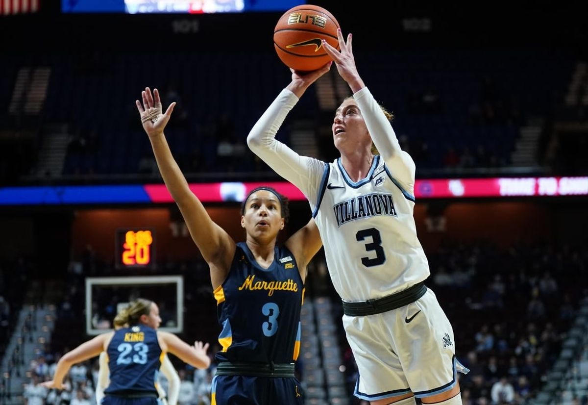 Mar 9, 2024; Uncasville, CT, USA; Villanova Wildcats guard Lucy Olsen (3) shoots against Marquette Golden Eagles guard Rose Nkumu (3) in the first half at Mohegan Sun Arena.