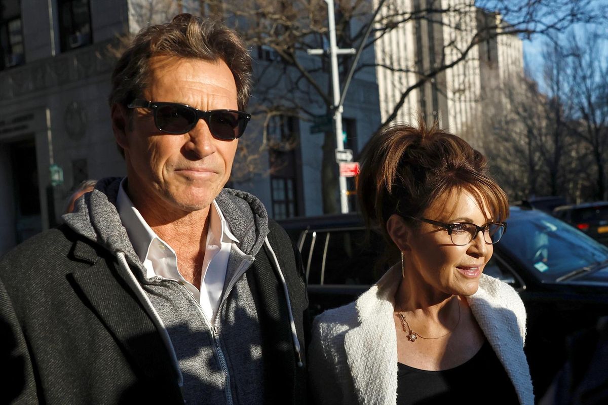 Sarah Palin arrives with former NHL hockey player Ron Duguay during her defamation lawsuit against the New York Times, at the United States Courthouse in the Manhattan borough of New York City, U.S., Feb. 10, 2022. REUTERS/Shannon Stapleton