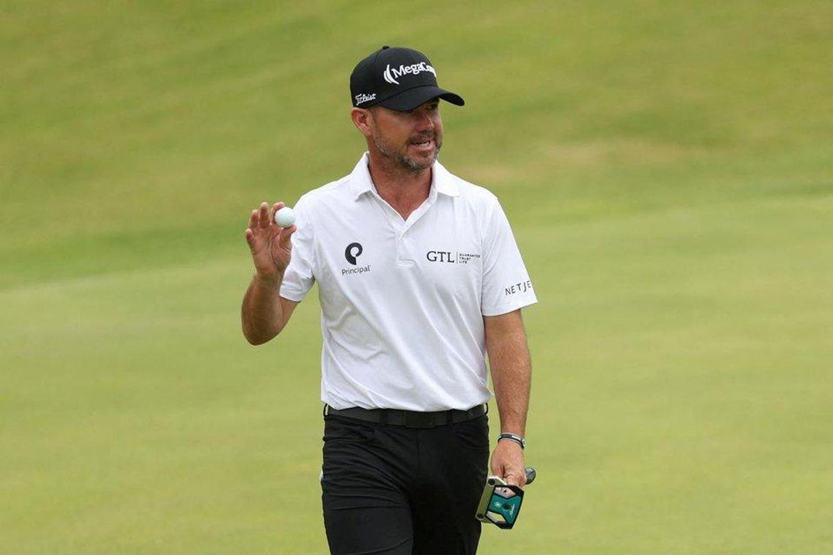 Brian Harman reacts on the 18th green after finishing his second round at the Open Championship played at Royal Portrush in Northern Ireland.
