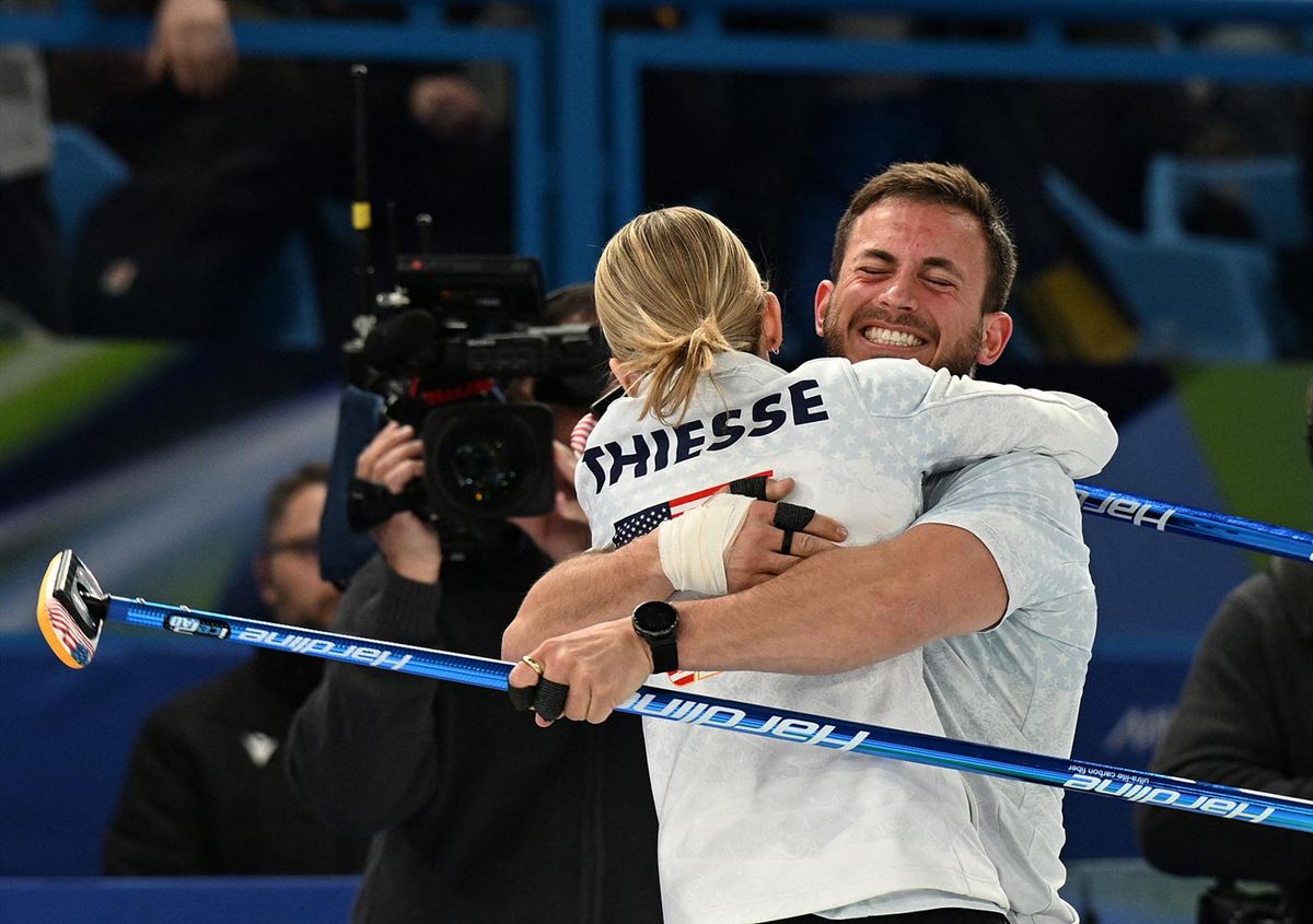 Korey Dropkin and Cory Thiesse of the United States celebrate winning against Amos Mosaner and Stefania Constantini of Italy in a curling mixed double semifinal