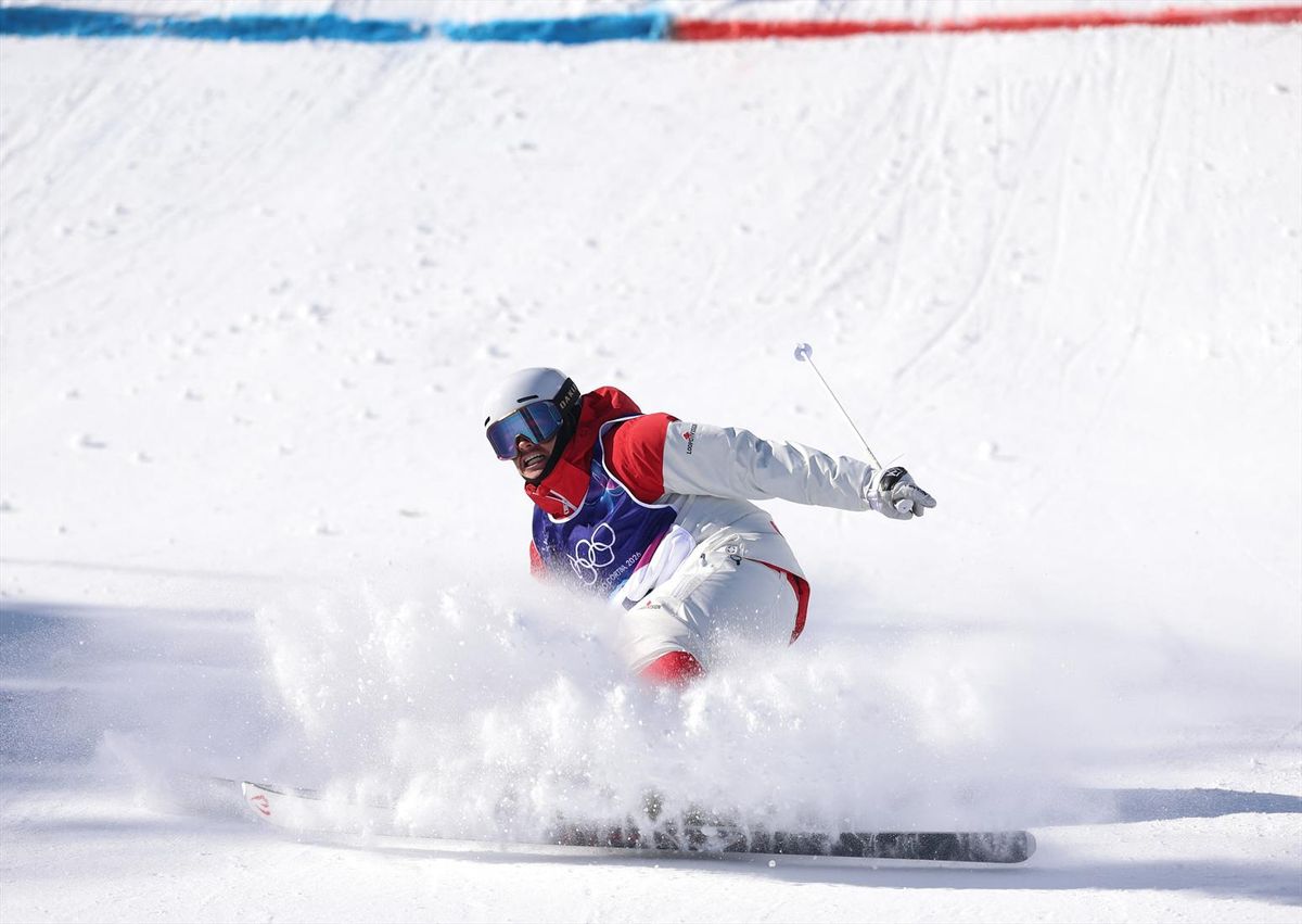 Mikael Kingsbury of Canada wins the gold medal in the men's dual moguls in Livigno, Italy, on Sunday at the Milan Cortina Olympics.
