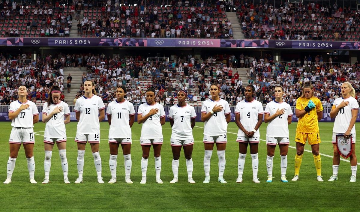 United States players line up during the national anthems before the match in Paris on Thursday.