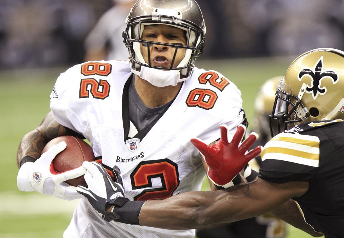 Tampa Bay Buccaneers tight end Kellen Winslow (L) gets taken by New Orleans Saints' safety Malcolm Jenkins during their NFL football game at the Mercedes-Benz Superdome in New Orleans, Louisiana November 6, 2011. The Saints beat the Buccaneers 27-16. REUTERS/Dan Anderson