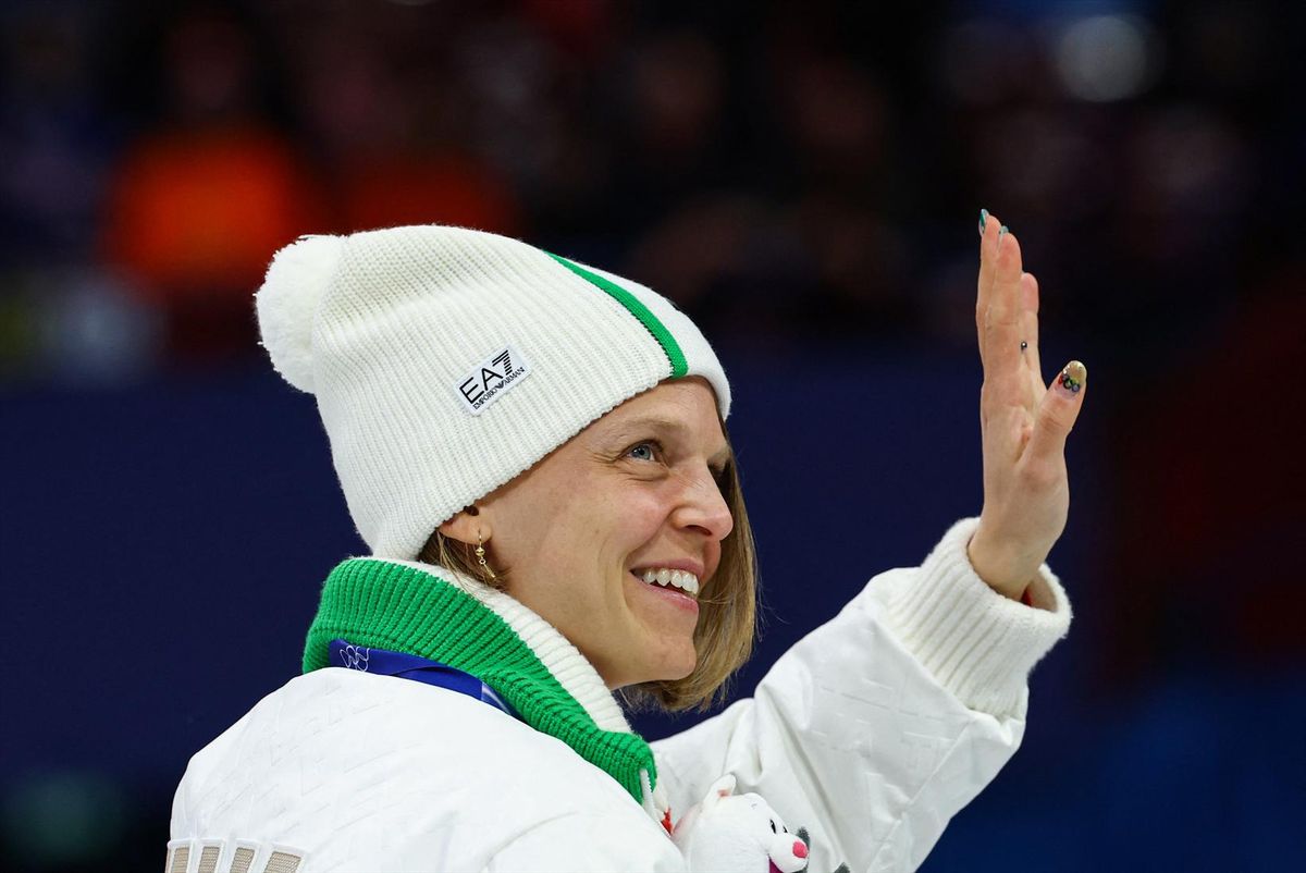 February 18, 2026. Silver medallist Arianna Fontana of Italy waves during the victory ceremony.
