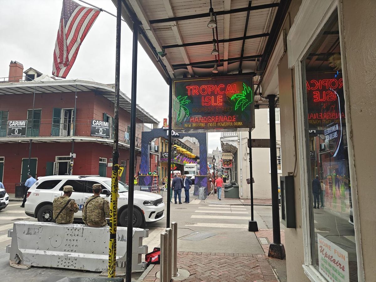 National guard personnel keep watch as Super Bowl preparations continue on Bourbon Street in the heart of the French Quarter in New Orleans.