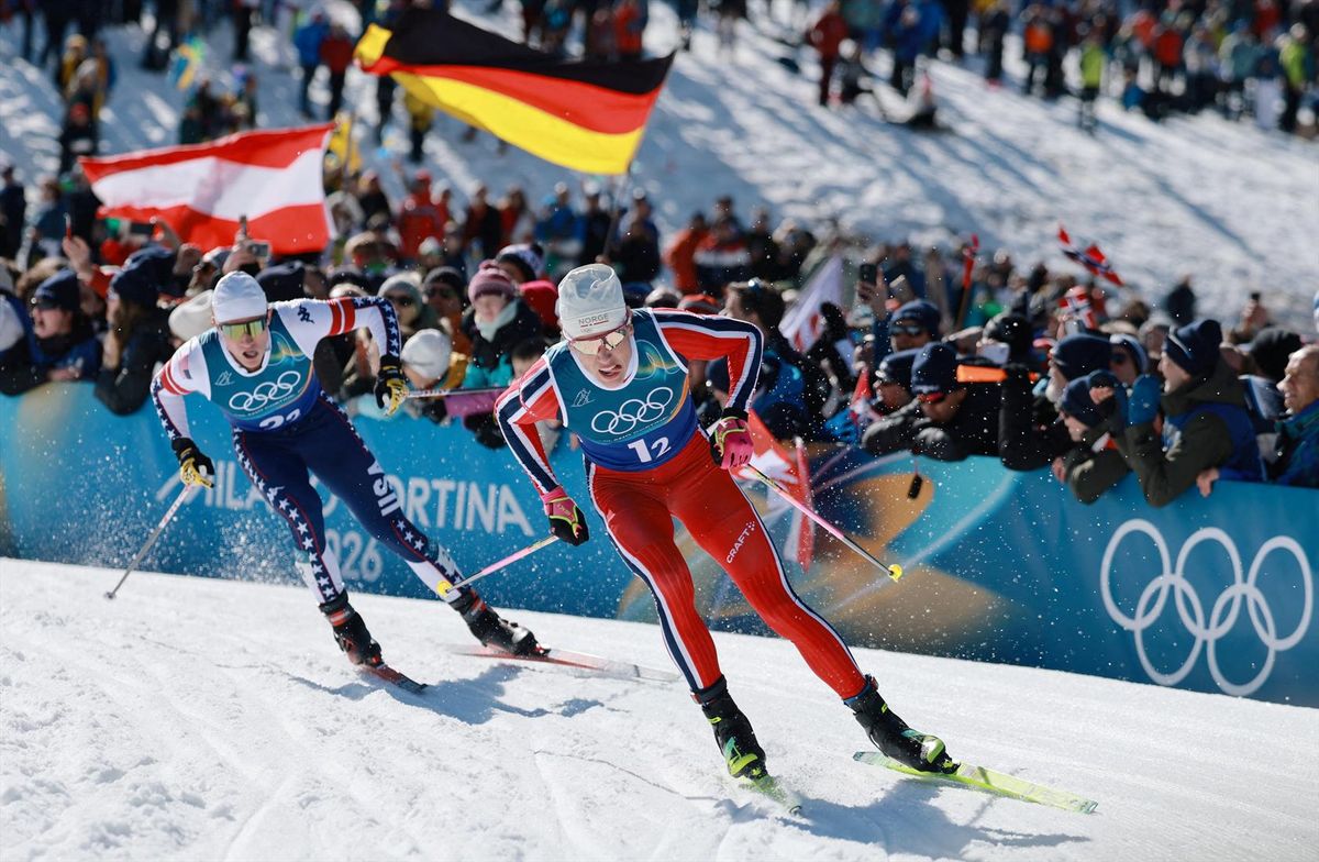 Johannes Hoesflot Klaebo of Norway and Gus Schumacher of United States in action during the men's cross country team sprint free final. Klaebo won his fifth gold medal of the Milano Cortina Olympics.