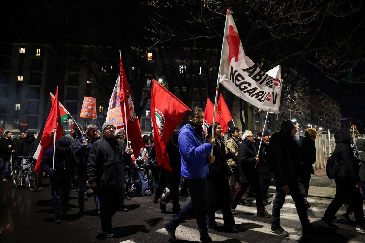 Demonstrators take to the streets as part of a protest organized by Committee Against Winter Olympics on the day of the opening ceremony for the Milan Cortina 2026 Winter Olympics, in the neighborhood of Segesta, in Milan, Italy, on Friday.