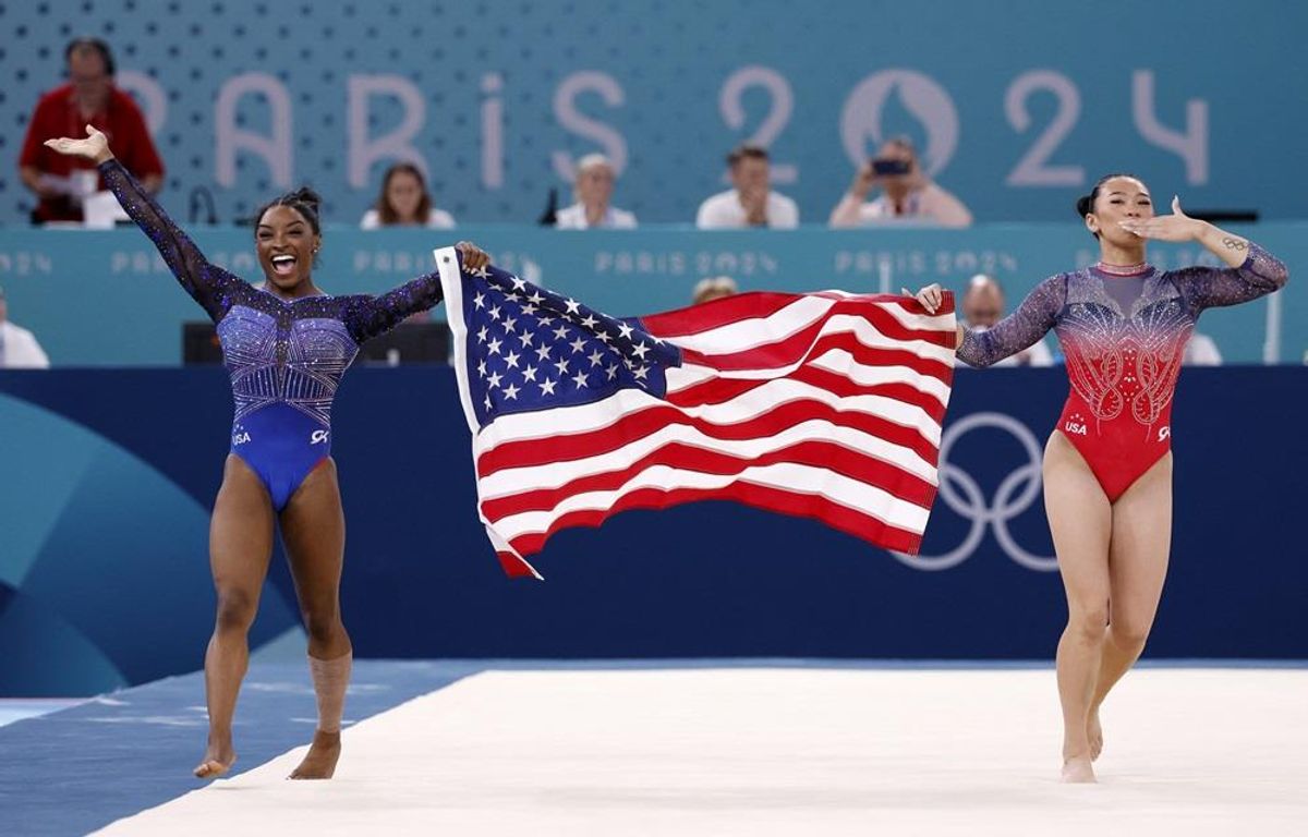 Simone Biles celebrates the gold medal in women's all-around with teammate and bronze medalist Sunisa Lee on Thursday in Paris.