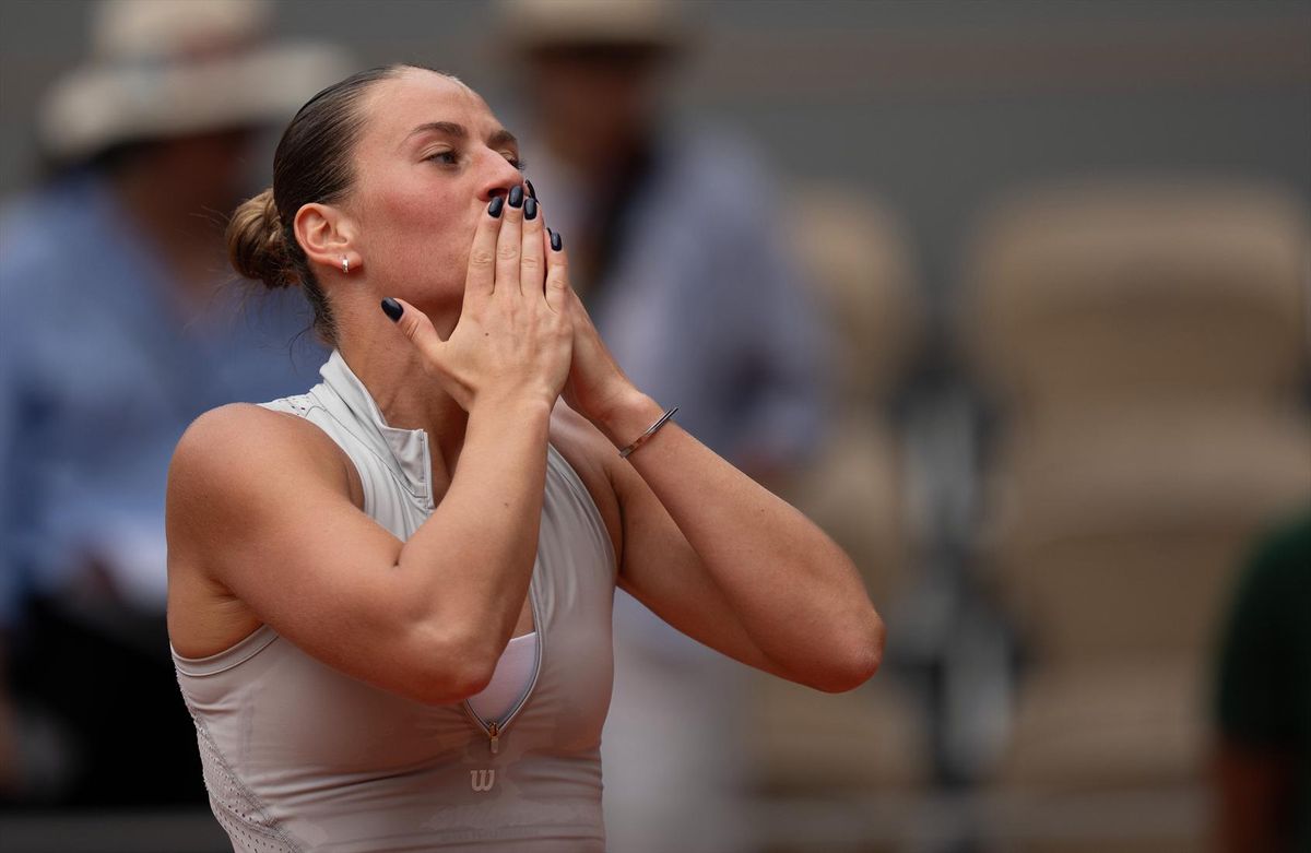 Marta Kostyuk of Ukraine celebrates winning her match against Iga Swiatek of Poland on Sunday at the French Open in Paris.