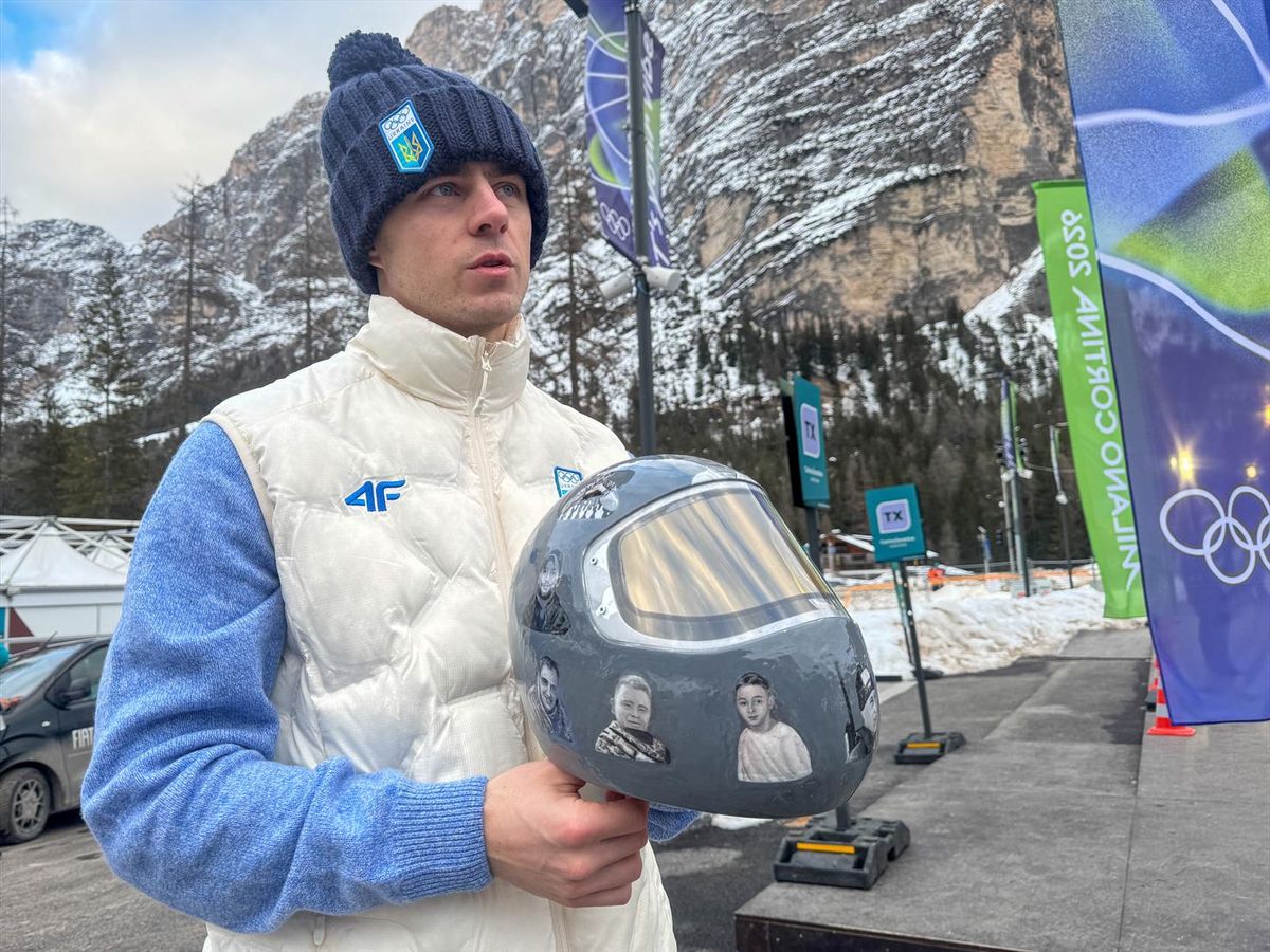 Ukrainian skeleton athlete Vladyslav Heraskevych holds his helmet with images of compatriots killed during the war in Ukraine, at the Milano Cortina Gamesin in Cortina D'Ampezzo, Italy, February 9, 2026.