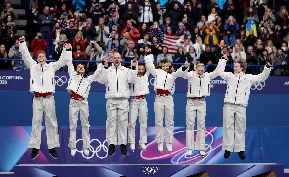 Gold medalists Ilia Malinin, Amber Glenn, Ellie Kam, Danny O'Shea, Madison Chock, Evan Bates and Alysa Liu of the United States celebrate on the podium after winning the team figure skating event