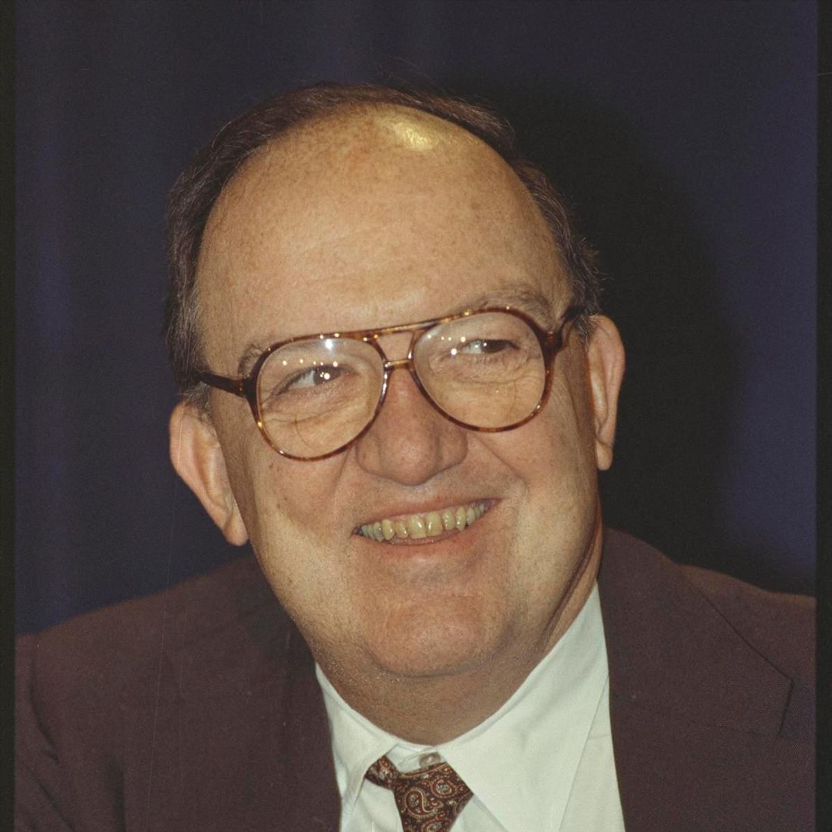 Baseball commissioner Fay Vincent smiles as he announces end of Major League Baseball lockout at NYPress conf. March 19, 1990. REUTERS/Mark Cardwell