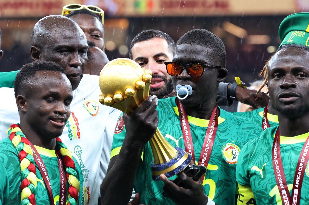 Senegal's El Hadji Malick Diouf celebrates with the trophy after winning the Africa Cup of Nations in Rabat, Morocco on Jan. 18, 2026.