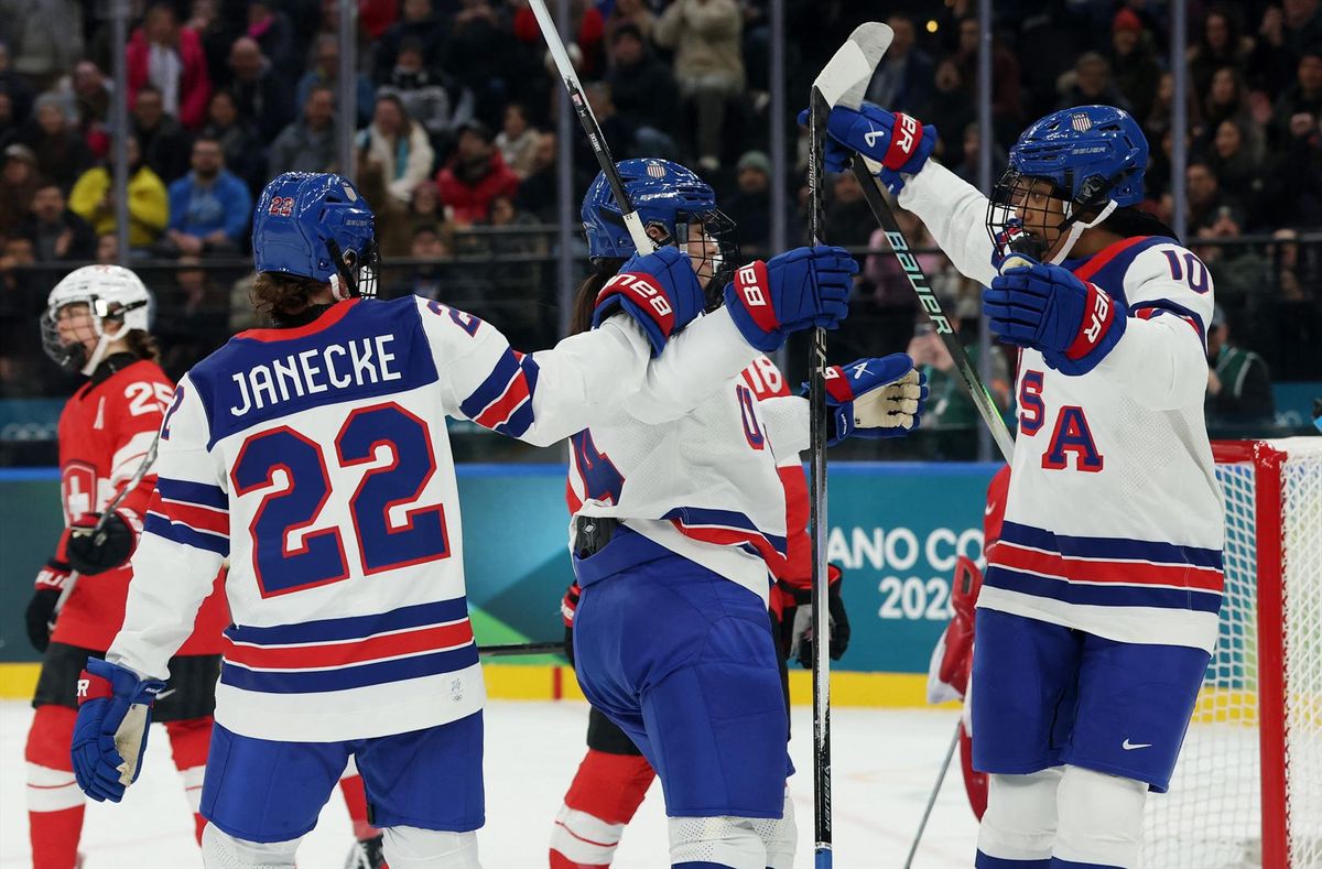 Joy Dunne of the United States celebrates with Tessa Janecke and Laila Edwards after scoring the team's second goal of its game against Switzerland in the Milan Cortina Olympics