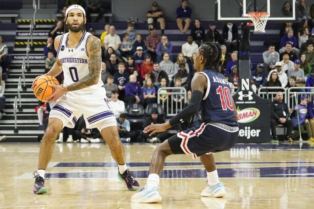 Dec 29, 2023; Evanston, Illinois, USA; Jackson State Tigers guard Chase Adams (10) defends Northwestern Wildcats guard Boo Buie (0) during the first half at Welsh-Ryan Arena.