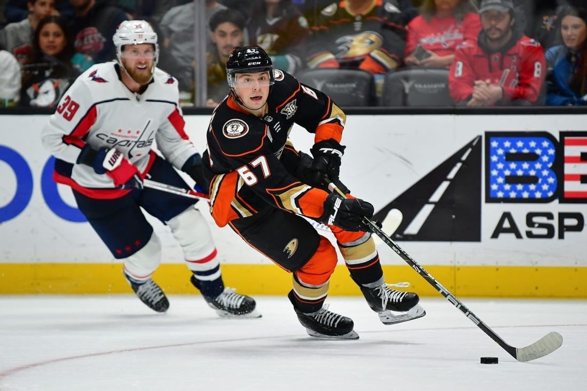 Nov 30, 2023; Anaheim, California, USA; Anaheim Ducks defenseman Tristan Luneau (67) moves the puck ahead of Washington Capitals right wing Anthony Mantha (39) during the third period at Honda Center.