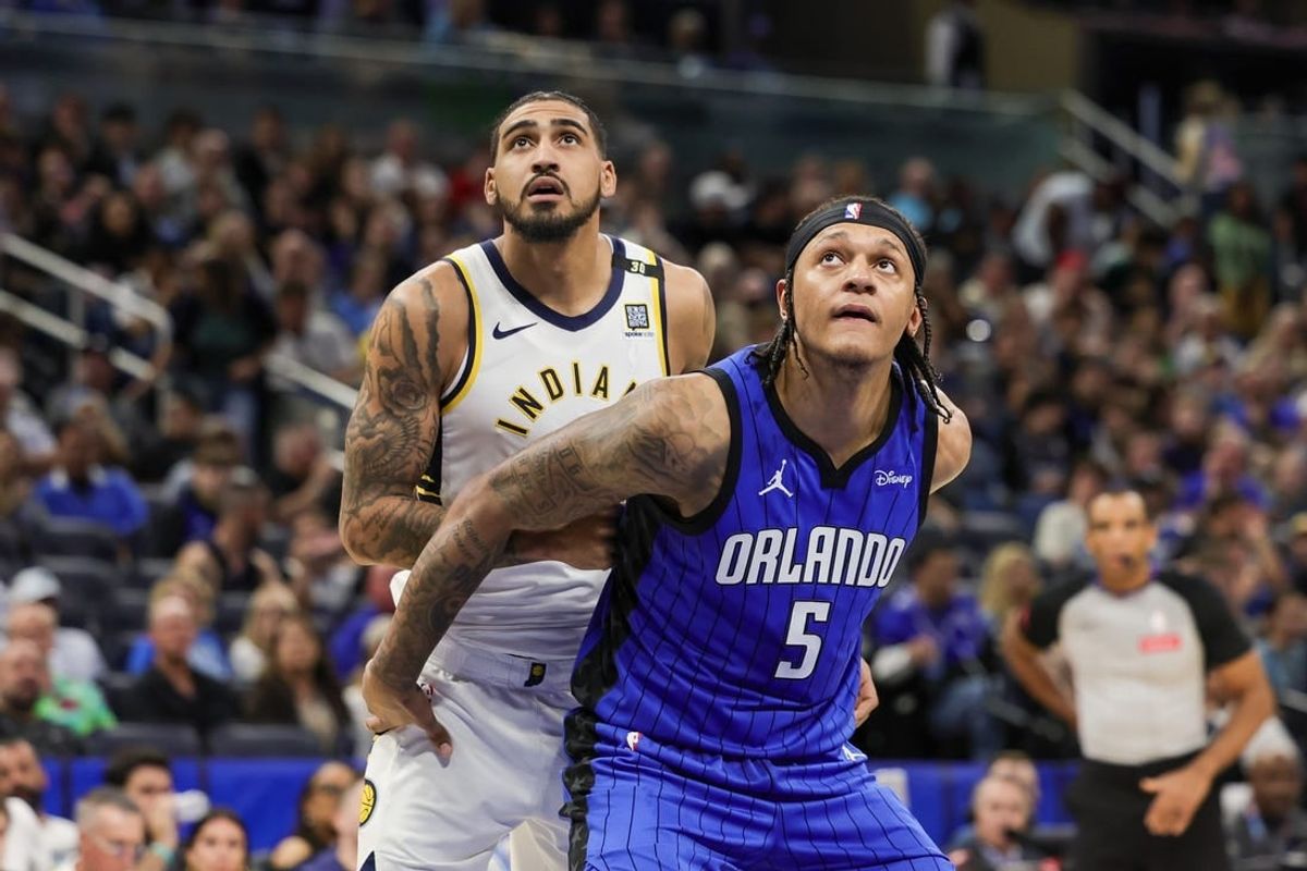 Mar 10, 2024; Orlando, Florida, USA; Orlando Magic forward Paolo Banchero (5) and Indiana Pacers forward Obi Toppin (1) look for the rebound during the second half at KIA Center.