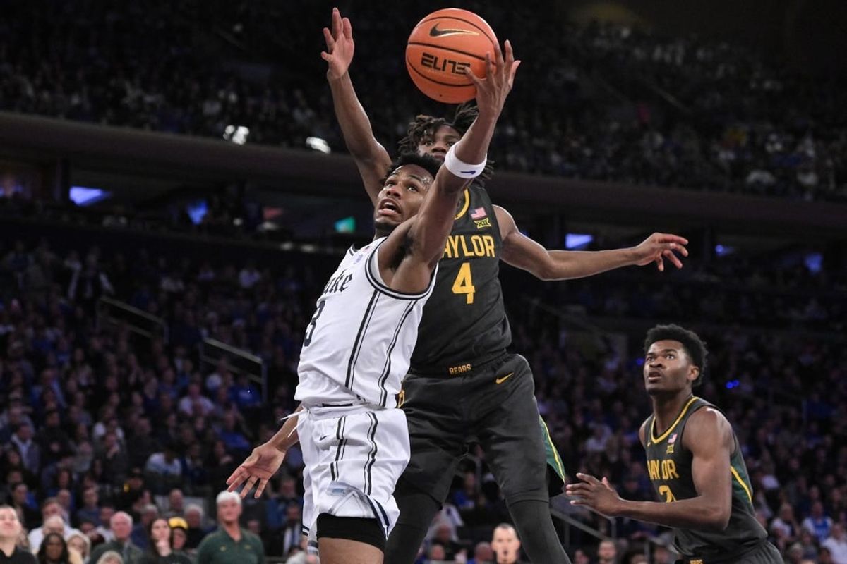 Dec 20, 2023; New York, New York, USA; Duke Blue Devils guard Jeremy Roach (3) shoots the ball as Baylor Bears guard Ja'Kobe Walter (4) defends during the first half at Madison Square Garden.