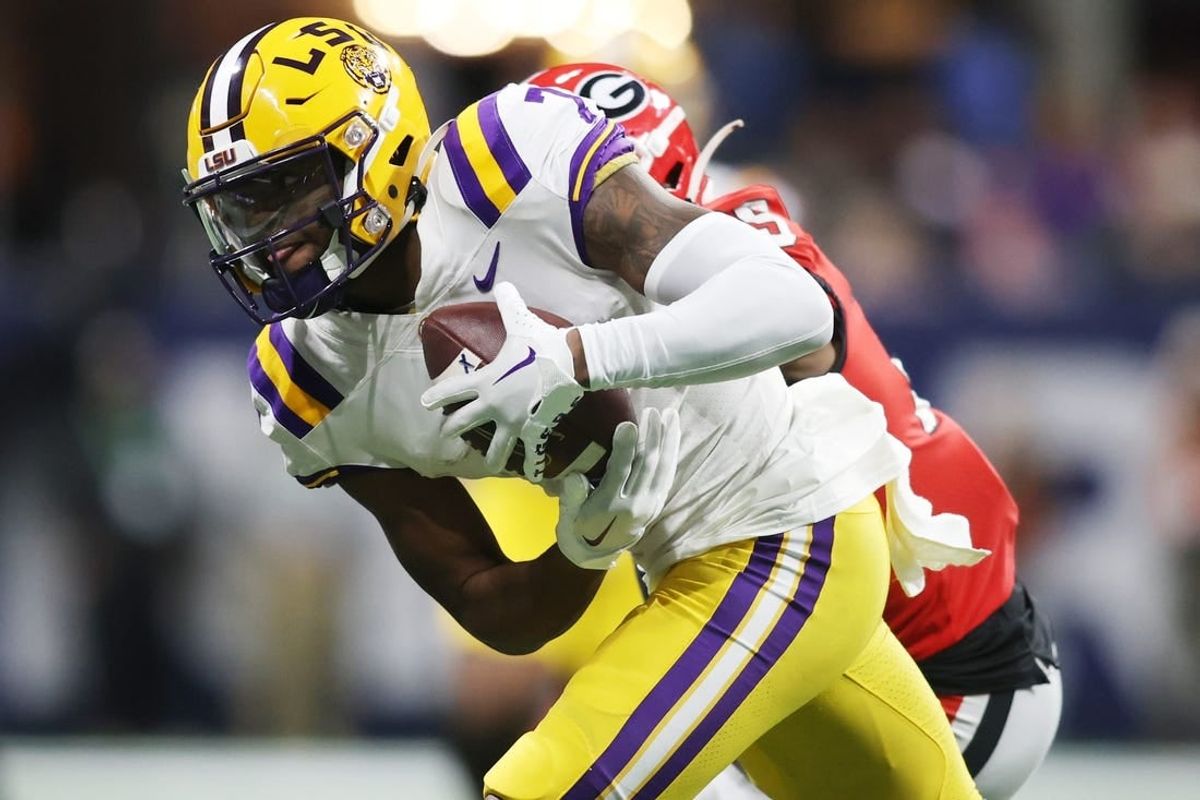 Dec 3, 2022; Atlanta, GA, USA; LSU Tigers wide receiver Kayshon Boutte (7) carries the ball following his reception against the Georgia Bulldogs during the second half at Mercedes-Benz Stadium.