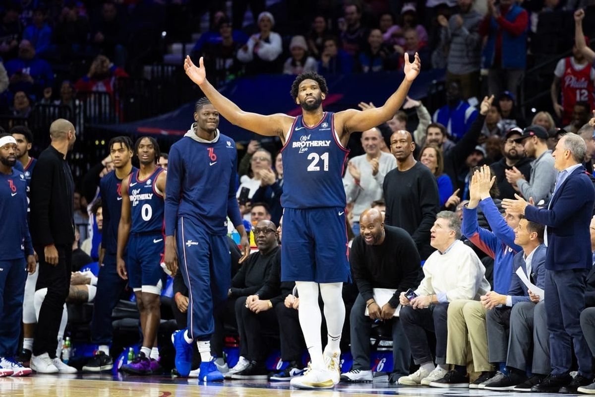 Dec 20, 2023; Philadelphia, Pennsylvania, USA; Philadelphia 76ers center Joel Embiid (21) reacts with fans after leaving the game in the closing seconds of a victory against the Minnesota Timberwolves at Wells Fargo Center.