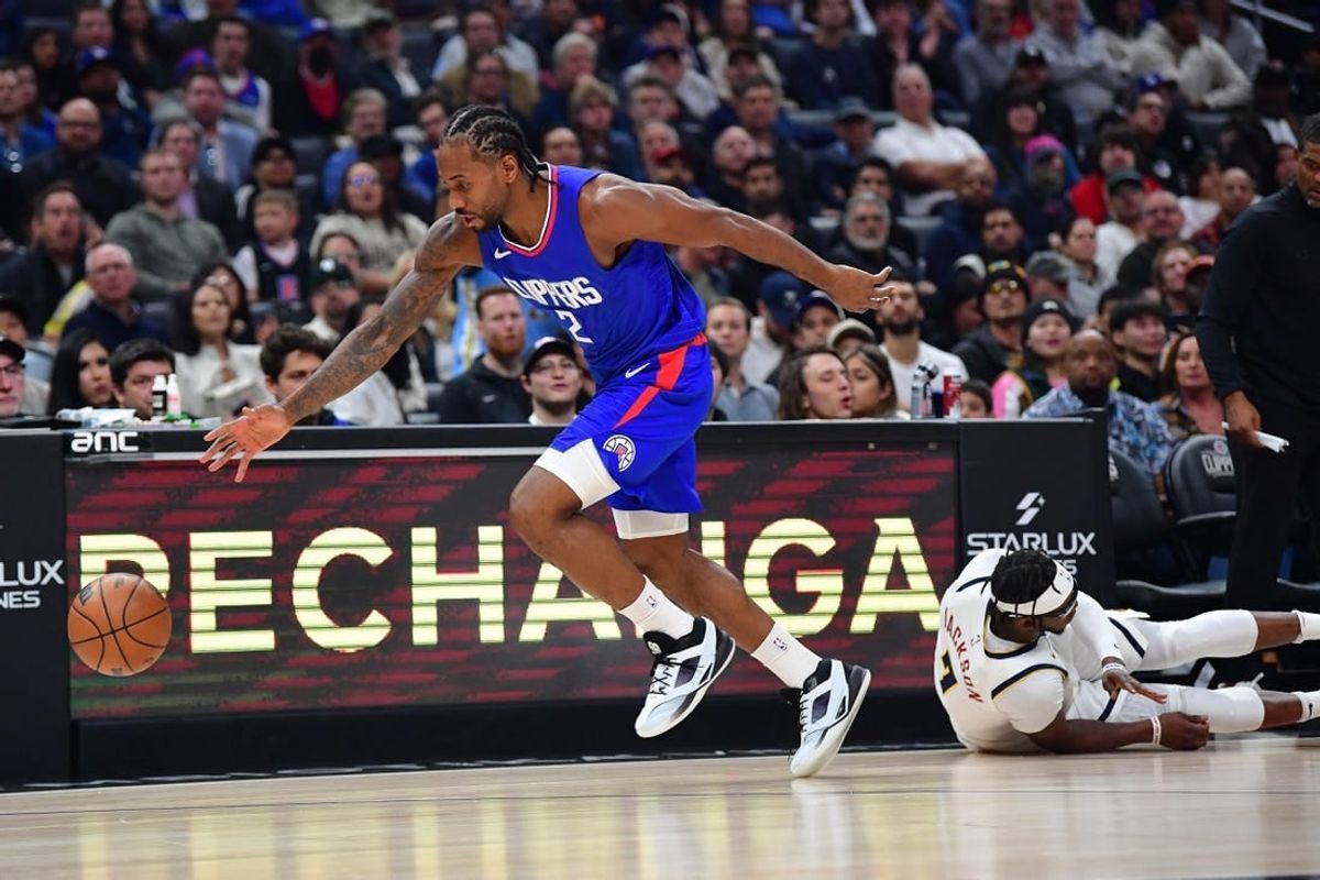 Nov 27, 2023; Los Angeles, California, USA; Los Angeles Clippers forward Kawhi Leonard (2) steals the ball from Denver Nuggets guard Reggie Jackson (7) during the first half at Crypto.com Arena.