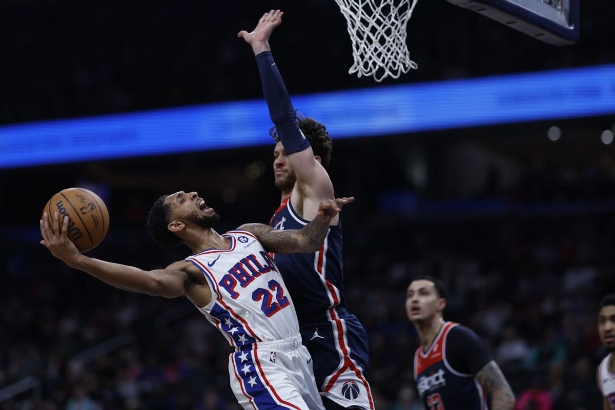 Feb 10, 2024; Washington, District of Columbia, USA; Philadelphia 76ers guard Cameron Payne (22) shoots the ball as Washington Wizards forward Corey Kispert (24) defends in the first half at Capital One Arena.